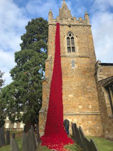 Poppies on a church tower