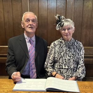 Dave and Ann signing the register